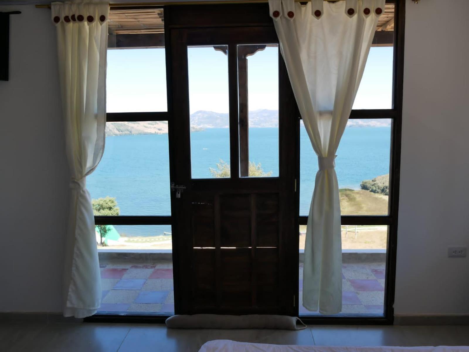 Hotel Tota Eliseo Playa Blanca Lago De Тота Екстериор снимка