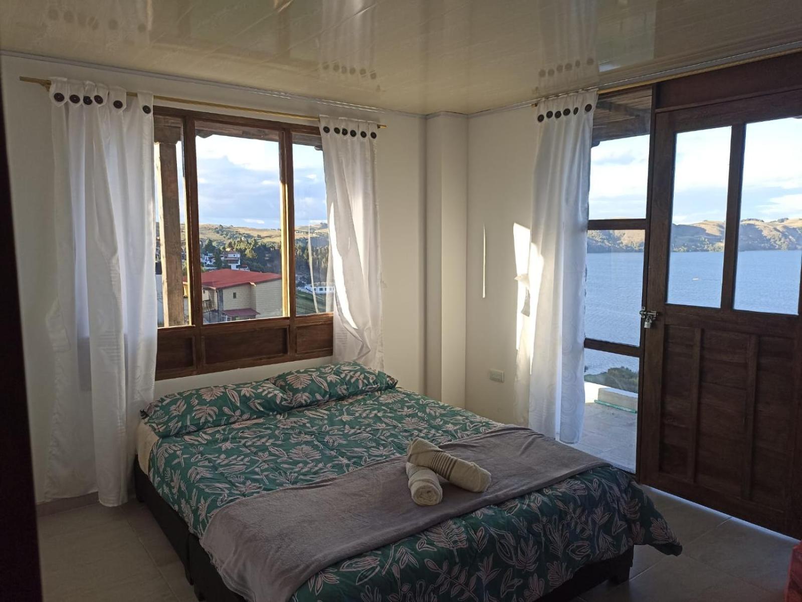 Hotel Tota Eliseo Playa Blanca Lago De Тота Екстериор снимка