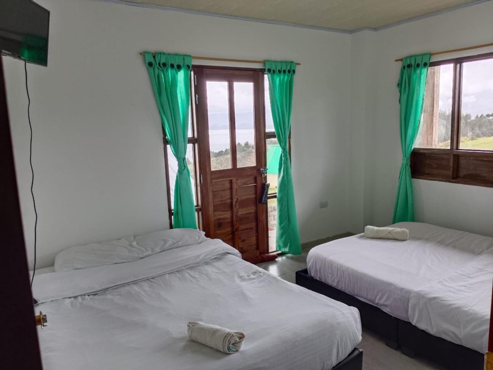 Hotel Tota Eliseo Playa Blanca Lago De Тота Екстериор снимка